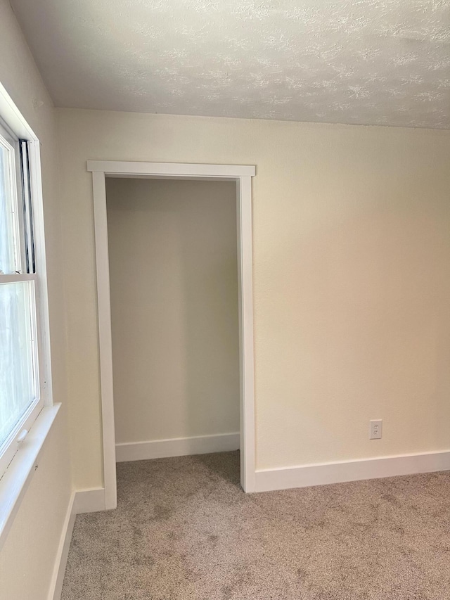 77 Travis Burchfield Rd, Strunk, KY 42649 - carpeted empty room with a textured ceiling and baseboards