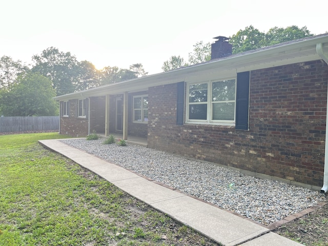 77 Travis Burchfield Rd, Strunk, KY 42649 - back of property featuring brick siding and a chimney