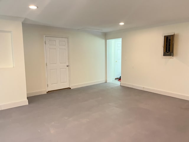 77 Travis Burchfield Rd, Strunk, KY 42649 - unfurnished room featuring recessed lighting, electric panel, baseboards, and concrete floors
