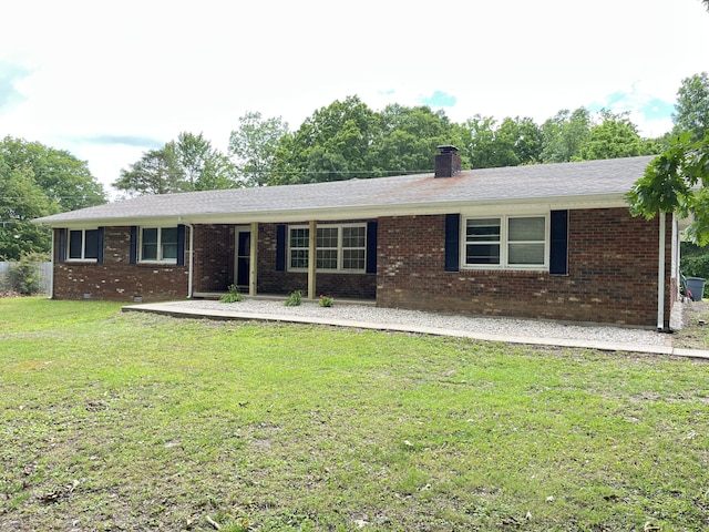 77 Travis Burchfield Rd, Strunk, KY 42649 - ranch-style house with a front yard, brick siding, and a chimney