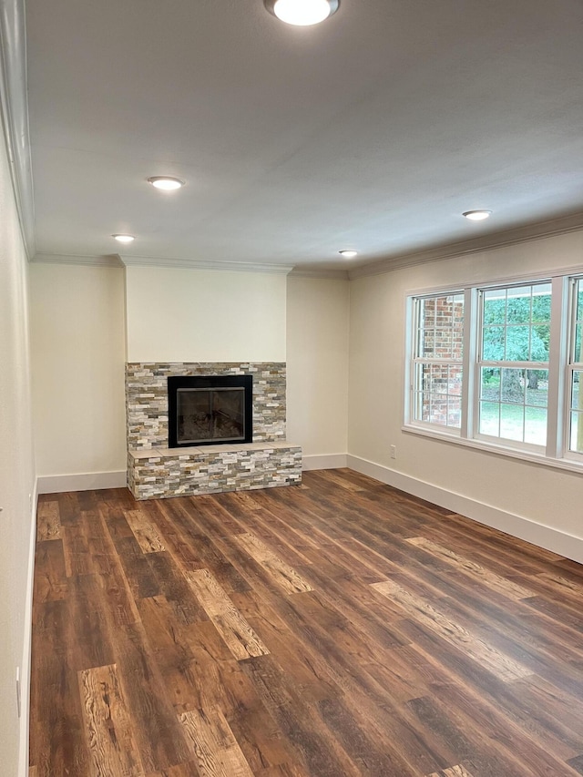 77 Travis Burchfield Rd, Strunk, KY 42649 - unfurnished living room with ornamental molding, wood finished floors, baseboards, a stone fireplace, and recessed lighting
