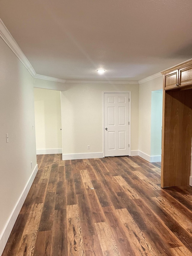 77 Travis Burchfield Rd, Strunk, KY 42649 - unfurnished room featuring crown molding, dark wood-style floors, and baseboards