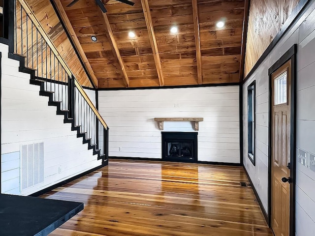 495 Pumpkin Creek Cir, Jamestown, KY 42629 - unfurnished living room with wood ceiling, wood-type flooring, a fireplace, stairs, and wooden walls