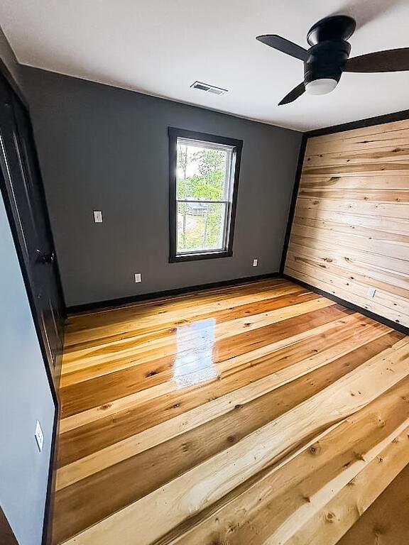 495 Pumpkin Creek Cir, Jamestown, KY 42629 - empty room featuring wood finished floors and a ceiling fan