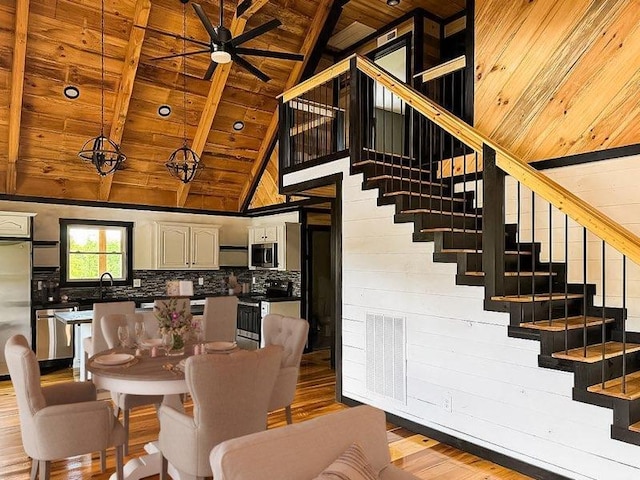 495 Pumpkin Creek Cir, Jamestown, KY 42629 - dining space with wood ceiling with exposed beams, stairs, light wood-style flooring, ceiling fan, and high vaulted ceiling