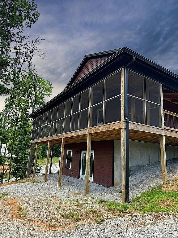 495 Pumpkin Creek Cir, Jamestown, KY 42629 - view of home's exterior featuring a sunroom