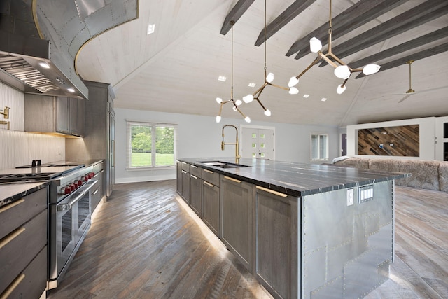 104 Barkley Ests, Nicholasville, KY 40356 - kitchen with a sink, double oven range, exhaust hood, dark wood-type flooring, and beamed ceiling