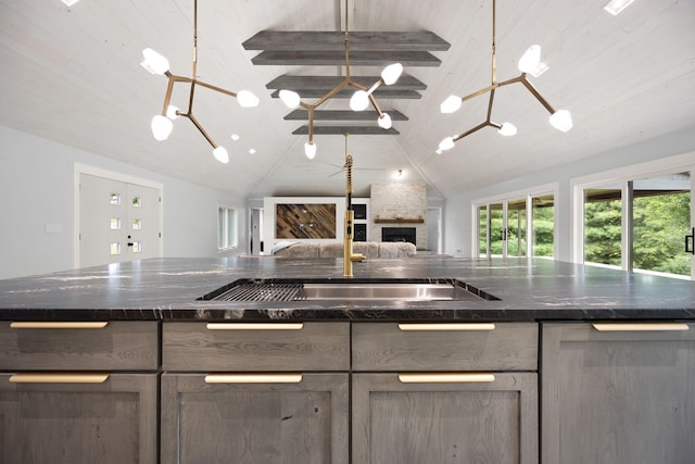 104 Barkley Ests, Nicholasville, KY 40356 - kitchen with open floor plan, lofted ceiling, a large fireplace, plenty of natural light, and a sink
