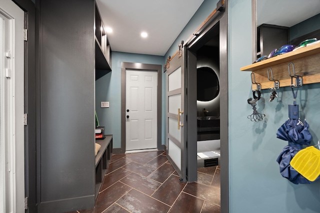 104 Barkley Ests, Nicholasville, KY 40356 - mudroom with a barn door, stone tile flooring, recessed lighting, and baseboards