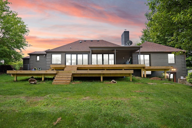 104 Barkley Ests, Nicholasville, KY 40356 - back of property at dusk with a chimney, a deck, stairway, and a yard