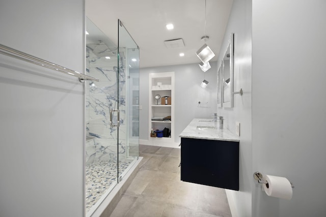 104 Barkley Ests, Nicholasville, KY 40356 - bathroom featuring a marble finish shower, built in shelves, double vanity, and recessed lighting