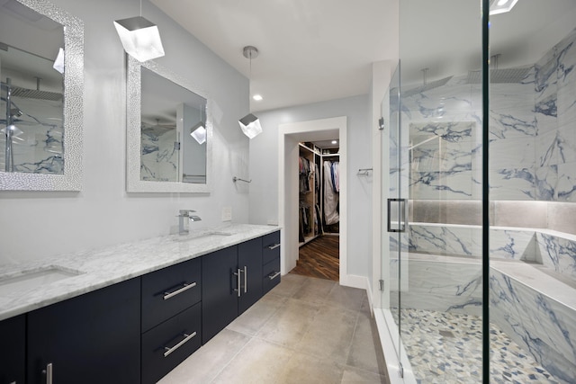 104 Barkley Ests, Nicholasville, KY 40356 - bathroom with a marble finish shower, double vanity, a spacious closet, and recessed lighting