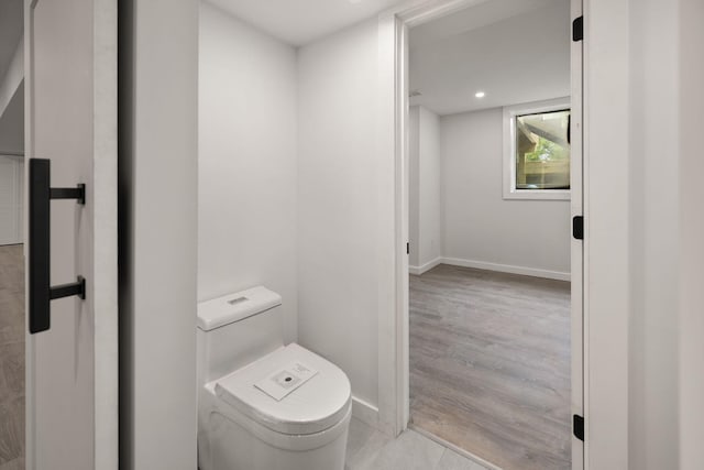 104 Barkley Ests, Nicholasville, KY 40356 - bathroom with toilet, baseboards, and wood finished floors