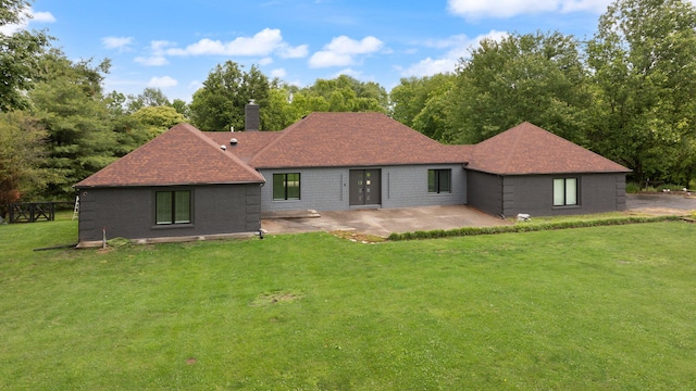 104 Barkley Ests, Nicholasville, KY 40356 - rear view of property featuring a patio, a yard, a chimney, and a shingled roof