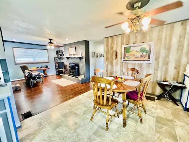 1465 Ky-1629, Corbin, KY 40701 - dining space with a ceiling fan, a textured ceiling, and a wood stove