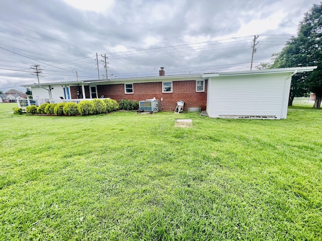 1465 Ky-1629, Corbin, KY 40701 - back of house with central AC, a yard, brick siding, and a chimney
