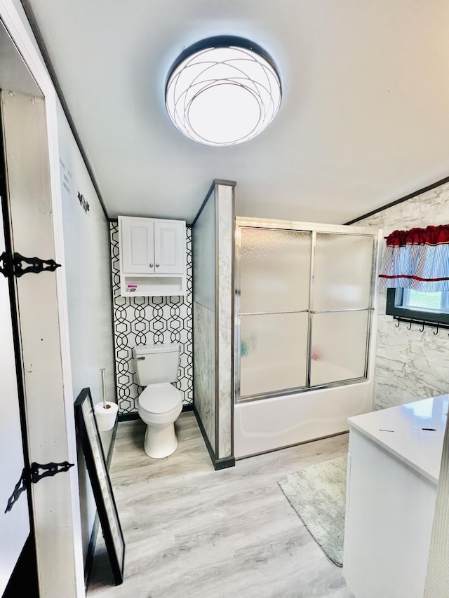 1465 Ky-1629, Corbin, KY 40701 - bathroom featuring wood finished floors, bath / shower combo with glass door, toilet, and a bidet