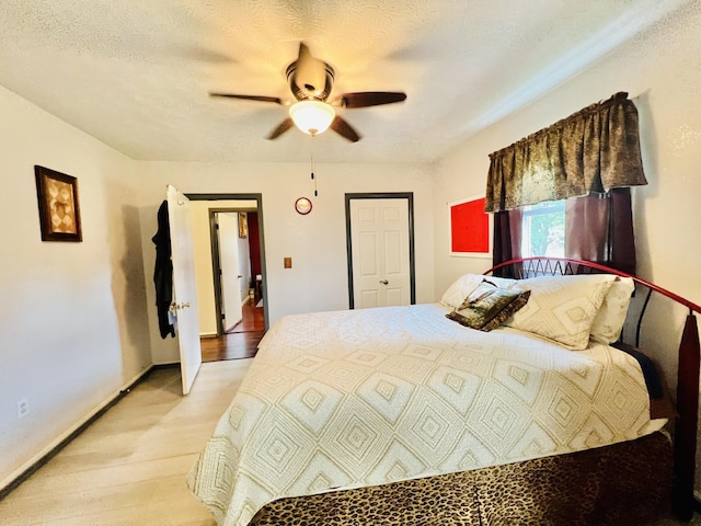 1465 Ky-1629, Corbin, KY 40701 - bedroom with light wood-style flooring, ceiling fan, and baseboards
