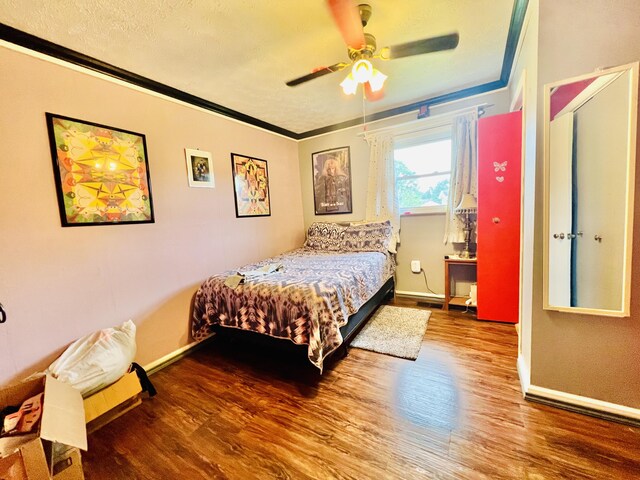 1465 Ky-1629, Corbin, KY 40701 - bedroom featuring wood finished floors, crown molding, baseboards, a textured ceiling, and ceiling fan