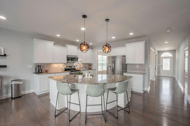 177 Swilcan Bridge Way, Georgetown, KY 40324 - kitchen featuring appliances with stainless steel finishes, decorative backsplash, healthy amount of natural light, dark wood-style flooring, and recessed lighting