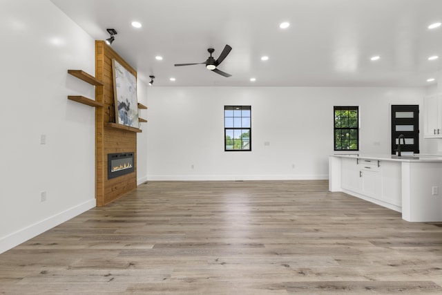 138 Hickory Grove Ln, Stanton, KY 40380 - unfurnished living room featuring recessed lighting, a ceiling fan, a fireplace, and light wood-style flooring