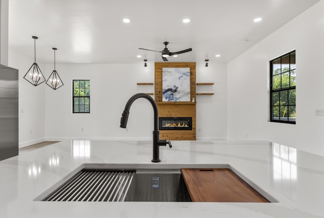 138 Hickory Grove Ln, Stanton, KY 40380 - kitchen with recessed lighting, plenty of natural light, a fireplace, a chandelier, and a ceiling fan