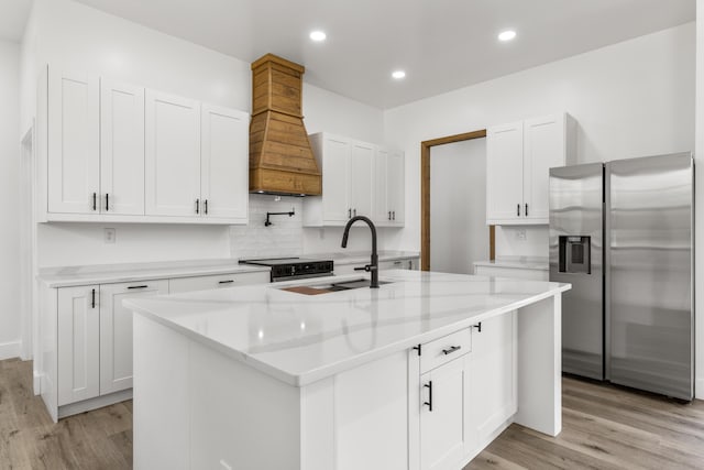 138 Hickory Grove Ln, Stanton, KY 40380 - kitchen featuring stainless steel fridge with ice dispenser, premium range hood, light wood-style flooring, white cabinets, and recessed lighting