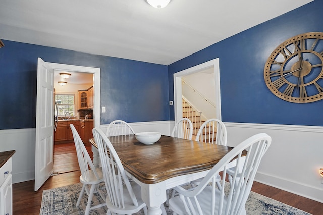 832 N 25th St, Middlesboro, KY 40965 - dining space featuring dark wood-style floors and a wainscoted wall