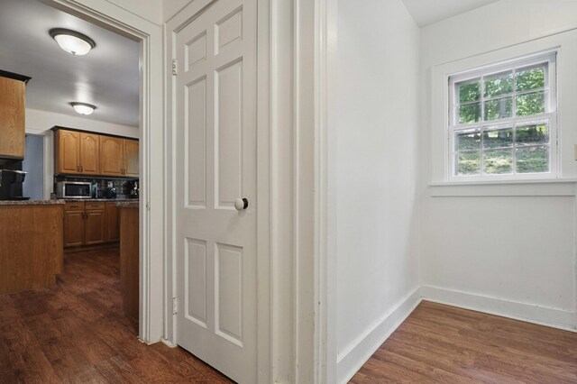 832 N 25th St, Middlesboro, KY 40965 - hall featuring dark wood-style flooring and baseboards
