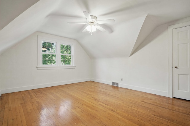 832 N 25th St, Middlesboro, KY 40965 - bonus room with wood-type flooring, vaulted ceiling, a ceiling fan, and baseboards