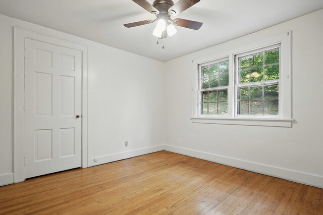832 N 25th St, Middlesboro, KY 40965 - empty room with baseboards, light wood finished floors, and a ceiling fan
