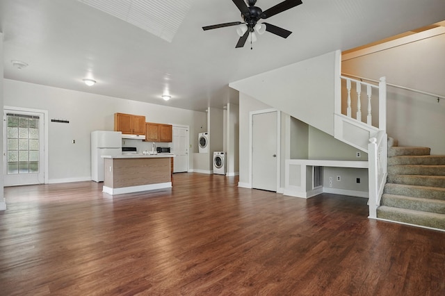 832 N 25th St, Middlesboro, KY 40965 - unfurnished living room featuring washer / clothes dryer, ceiling fan, dark wood-style flooring, and stairs