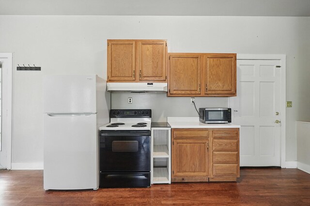 832 N 25th St, Middlesboro, KY 40965 - kitchen with freestanding refrigerator, range with electric cooktop, under cabinet range hood, and dark wood-type flooring