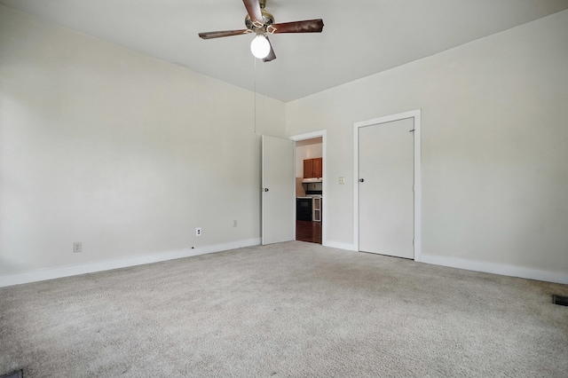 832 N 25th St, Middlesboro, KY 40965 - unfurnished bedroom with carpet, baseboards, and a ceiling fan