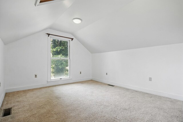 832 N 25th St, Middlesboro, KY 40965 - additional living space with vaulted ceiling, carpet, and baseboards