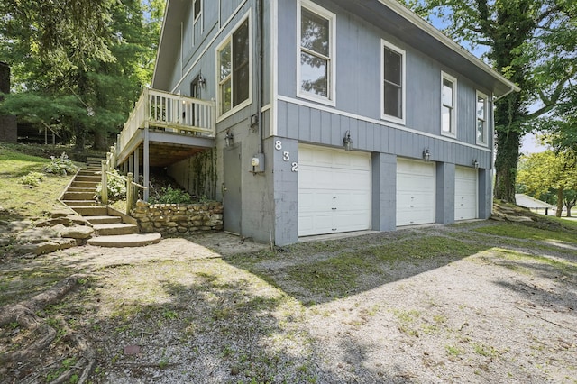 832 N 25th St, Middlesboro, KY 40965 - view of side of property with a garage, stairway, and driveway