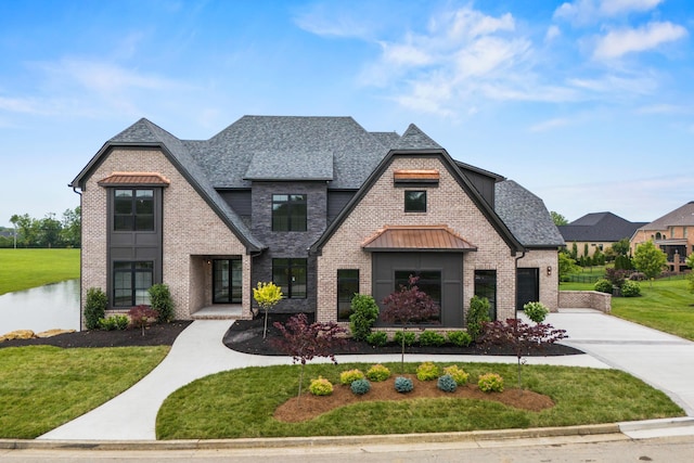 3852 Silver Charm Ln, Lexington, KY 40509 - french provincial home with driveway, brick siding, a front yard, and roof with shingles