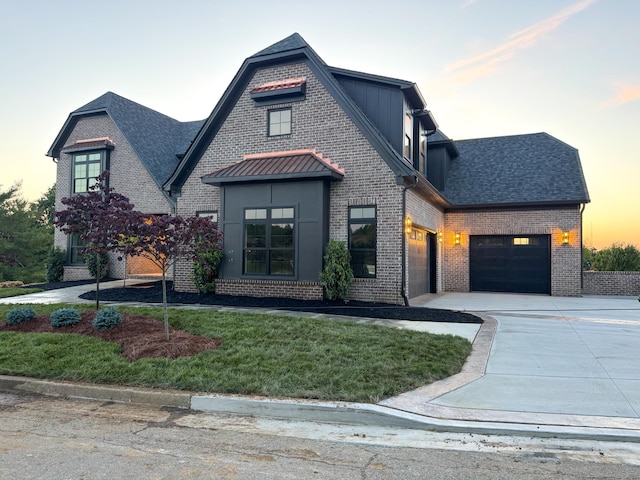 3852 Silver Charm Ln, Lexington, KY 40509 - view of front of house featuring driveway, brick siding, a garage, and a lawn