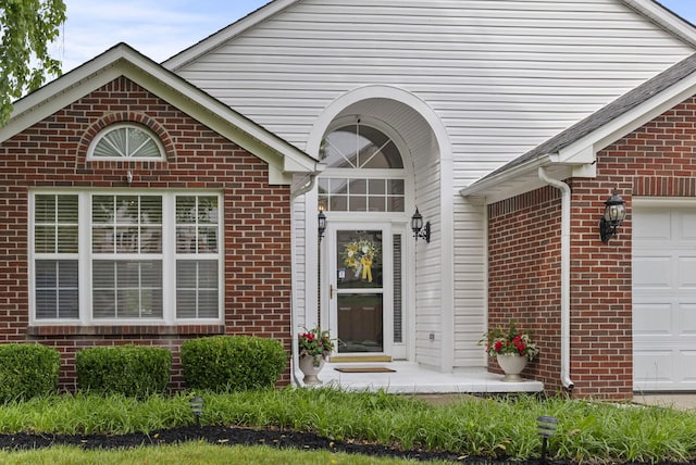 1217 Wyndham Hills Dr, Lexington, KY 40514 - view of exterior entry with brick siding and a garage
