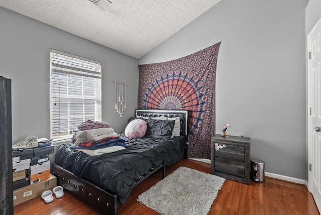1217 Wyndham Hills Dr, Lexington, KY 40514 - bedroom featuring lofted ceiling, a textured ceiling, wood finished floors, and baseboards