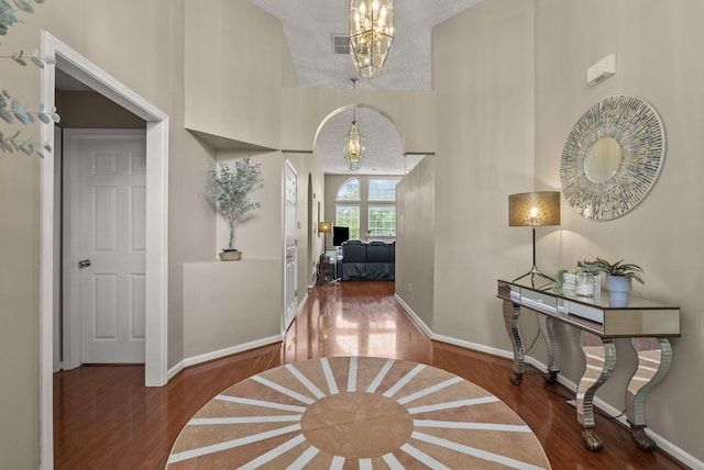 1217 Wyndham Hills Dr, Lexington, KY 40514 - corridor with a chandelier, wood finished floors, and baseboards