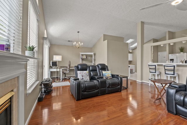 1217 Wyndham Hills Dr, Lexington, KY 40514 - living room featuring a fireplace, a textured ceiling, wood finished floors, a chandelier, and an office area