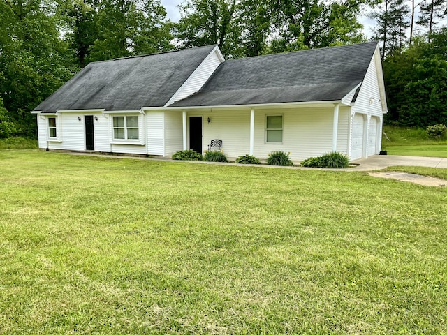 2953 Somerset Rd, London, KY 40741 - view of front facade with a shingled roof, a front yard, concrete driveway, and view of wooded area