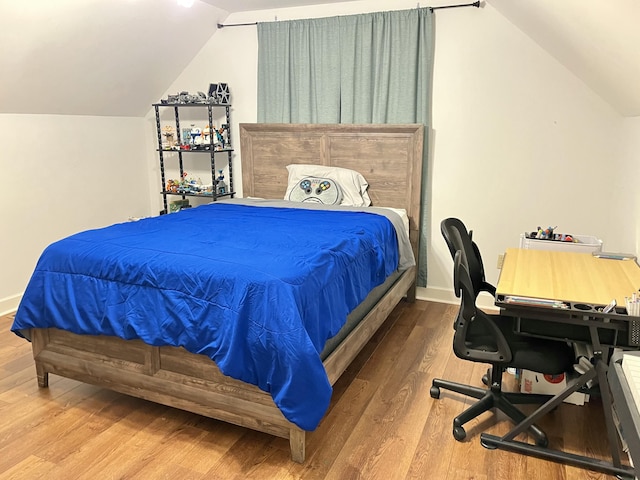2953 Somerset Rd, London, KY 40741 - bedroom with lofted ceiling, wood finished floors, and baseboards