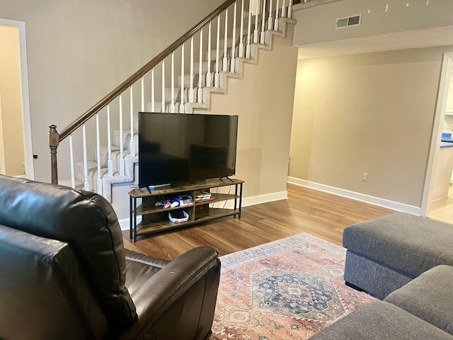 2953 Somerset Rd, London, KY 40741 - living area featuring wood finished floors, stairway, and baseboards