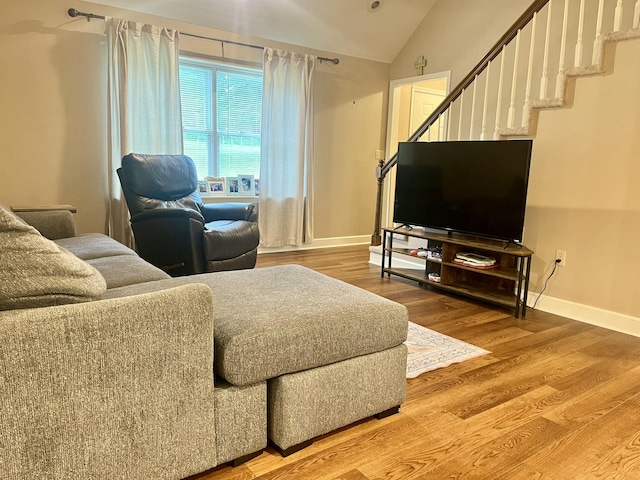 2953 Somerset Rd, London, KY 40741 - living area with vaulted ceiling, baseboards, wood finished floors, and stairway