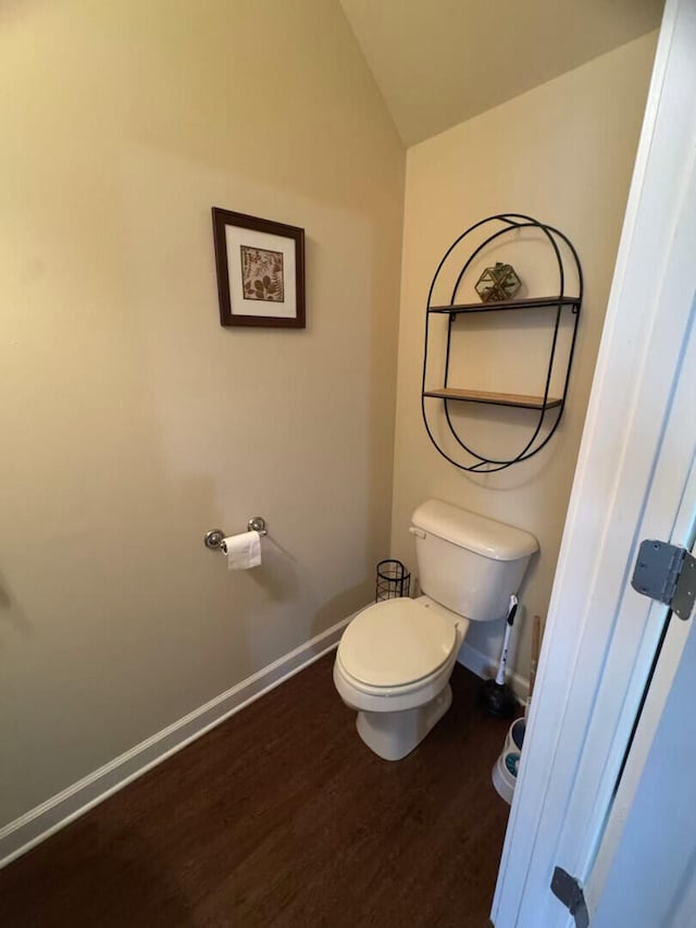 2765 Meadowsweet Ln, Lexington, KY 40511 - bathroom with baseboards, wood finished floors, toilet, and vaulted ceiling