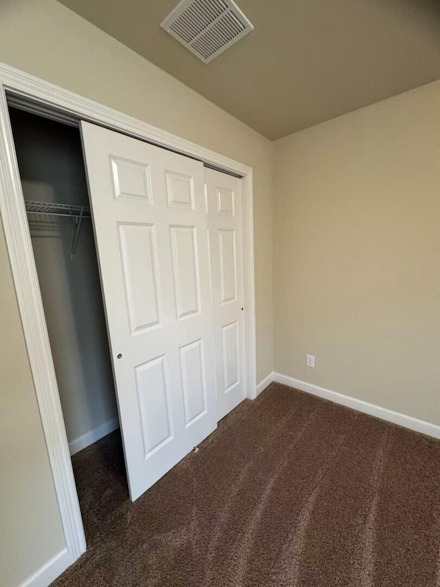 2765 Meadowsweet Ln, Lexington, KY 40511 - unfurnished bedroom featuring dark colored carpet, baseboards, and a closet