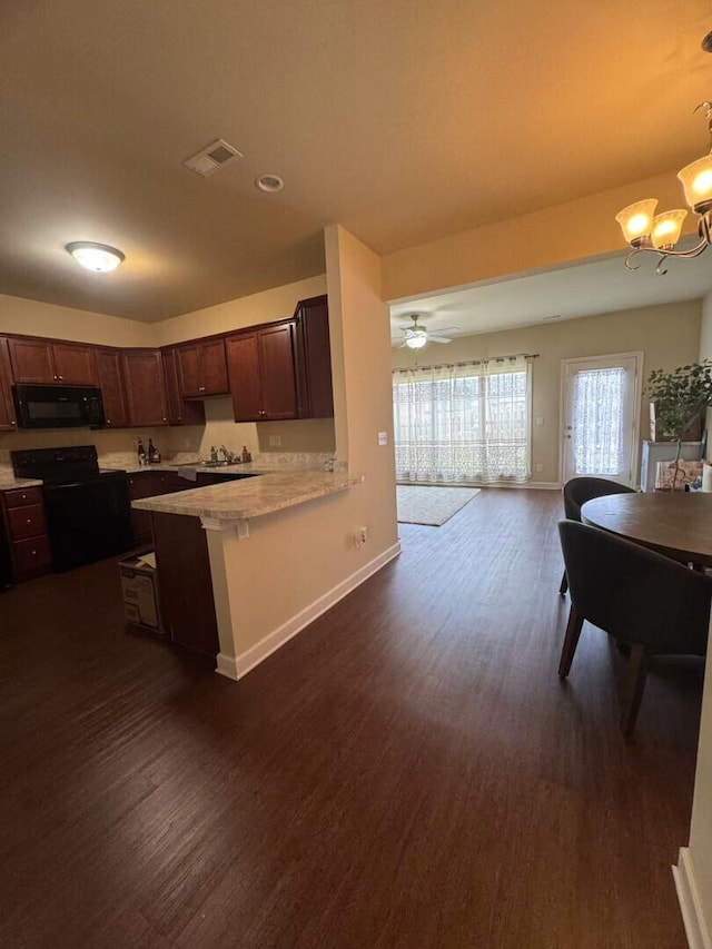 2765 Meadowsweet Ln, Lexington, KY 40511 - kitchen featuring black appliances, light countertops, dark wood-type flooring, and a chandelier