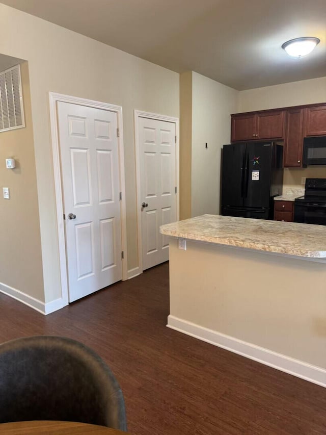 2765 Meadowsweet Ln, Lexington, KY 40511 - kitchen with black appliances, baseboards, and dark wood-type flooring